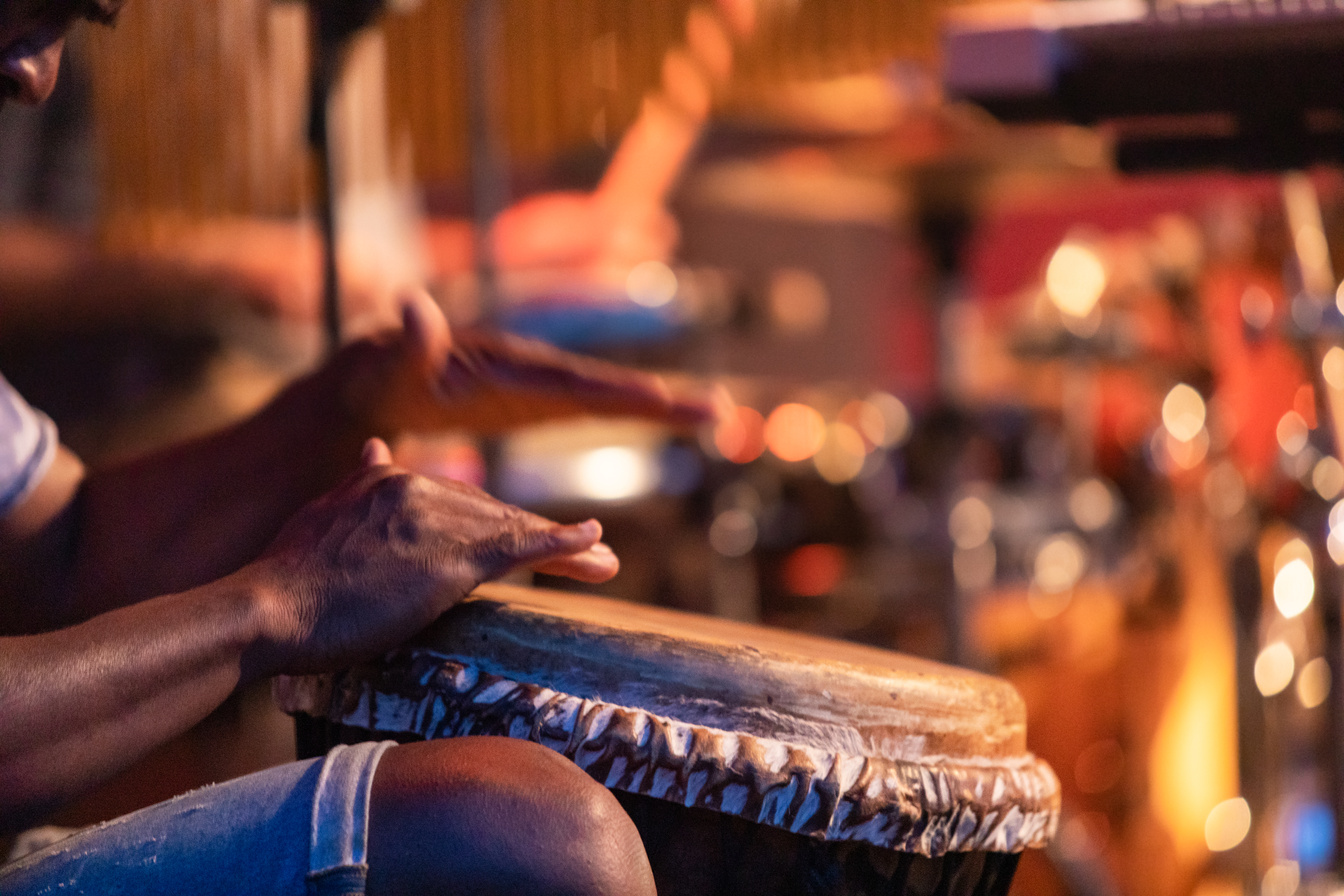 playing a African djembe drum